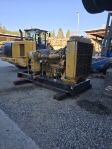 Engine and generator supported on cribbing blocks during servicing