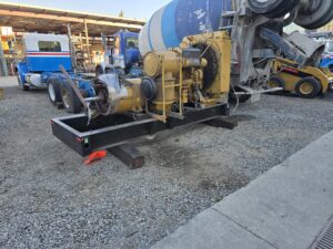 Heavy equipment supported with timber blocks on gravel surface
